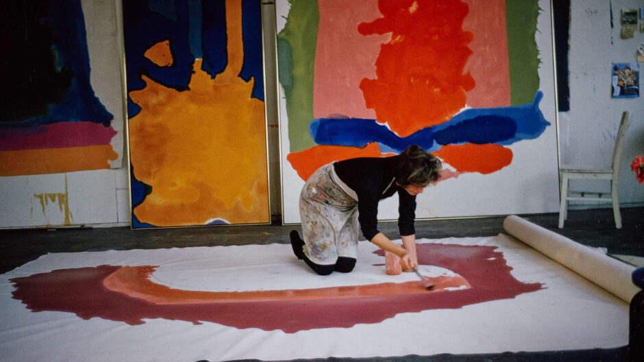 Helen Frankenthaler spreading paint, New York, 1964. Photo: Alexander Liberman © J. Paul Getty Trust.