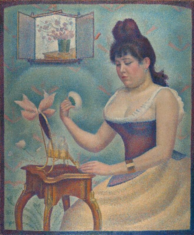 Woman sitting down with powder and mirror