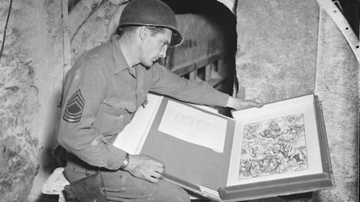 An American GI inspects a looted Durer print in the Merkers salt mine complexines.