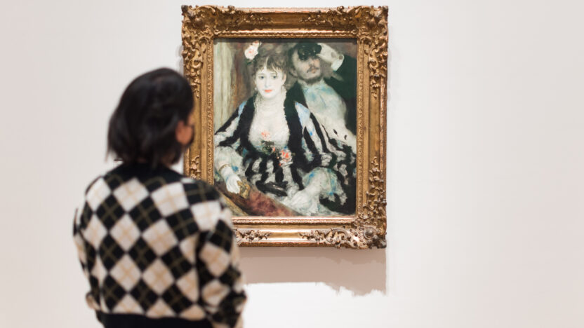 Lady looking at Pierre-Auguste Renoir's La Loge in the renovated Courtauld Gallery