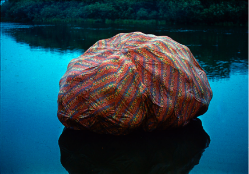 Photograph showing a large multicoloured deflating balloon structure