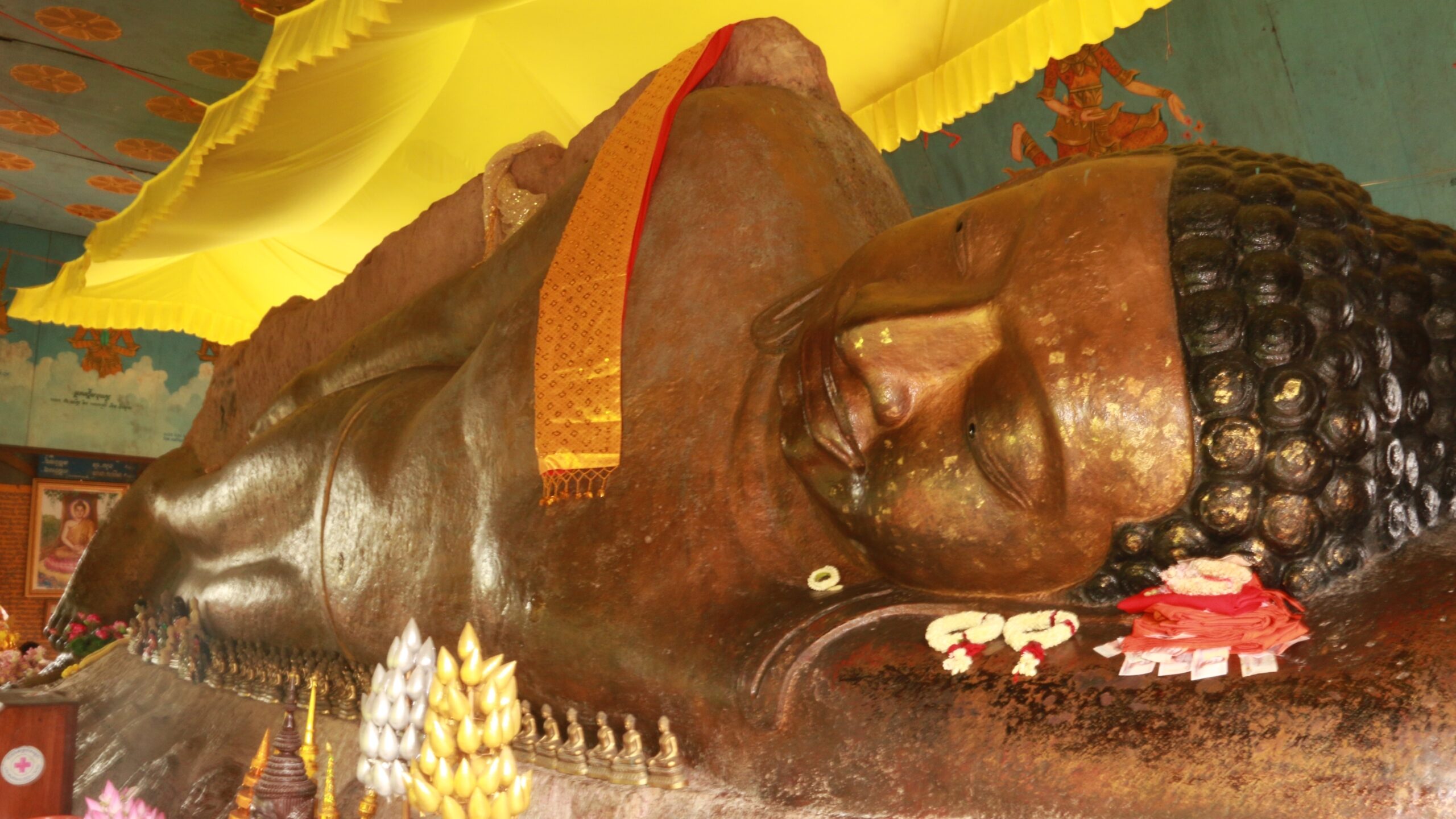 Photograph of a large statue of Buddha in a lying position