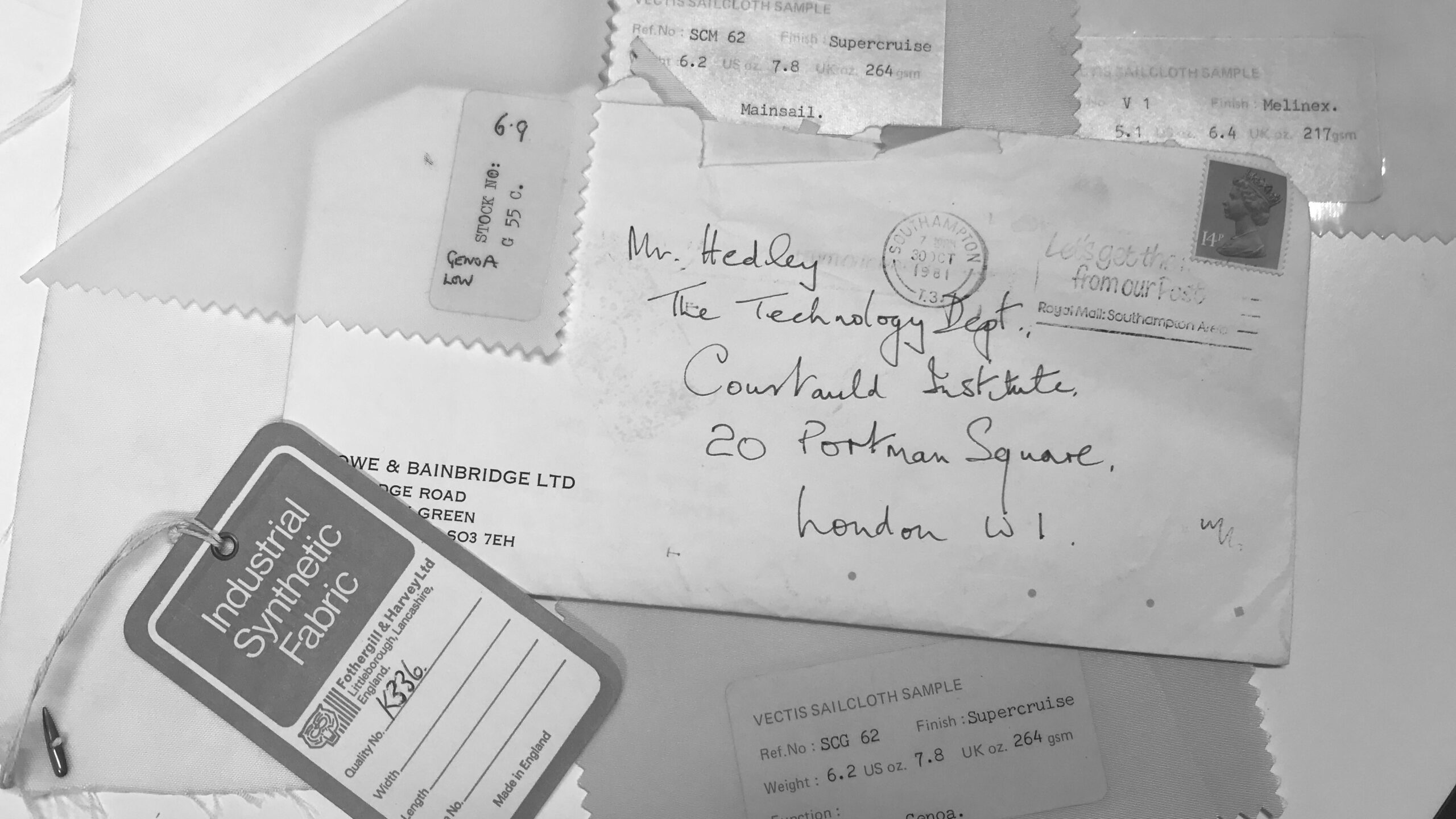 A collection of handwritten letters, tags and samples in black and white