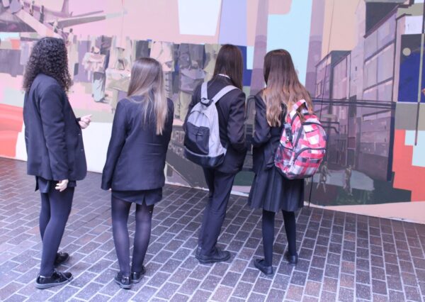 Y9 Students look over the mural in progress
