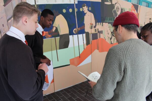 Gavin Renshaw talks to Y9 students about their feedback on the mural