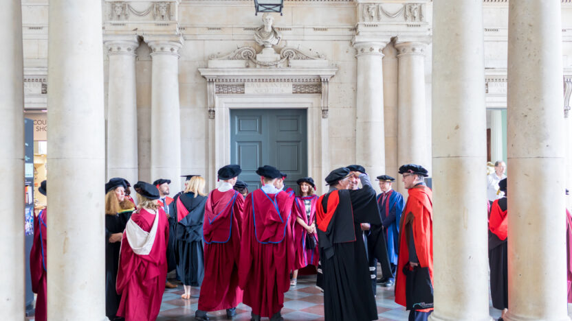 students and staff at graduation
