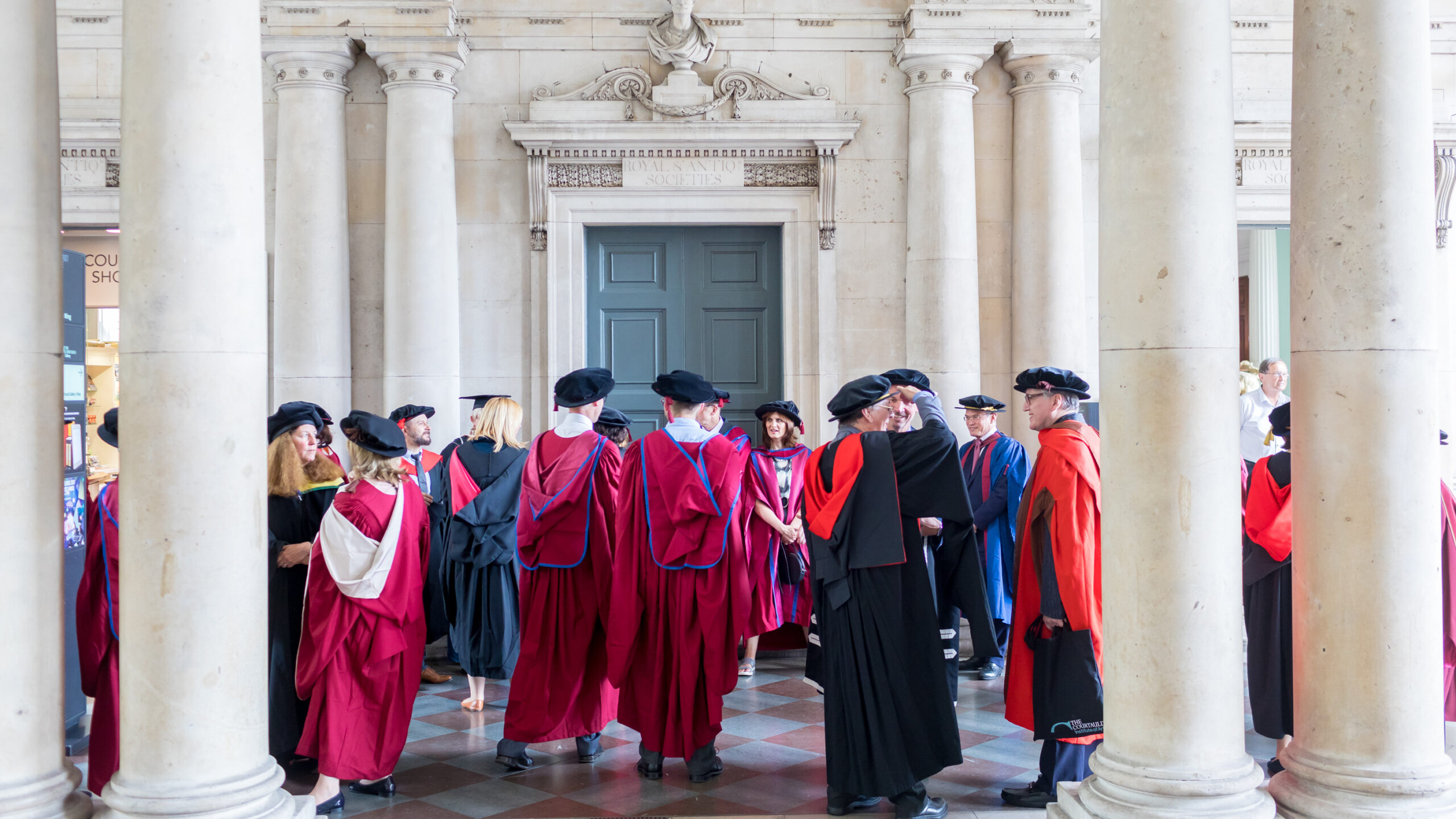 students and staff at graduation