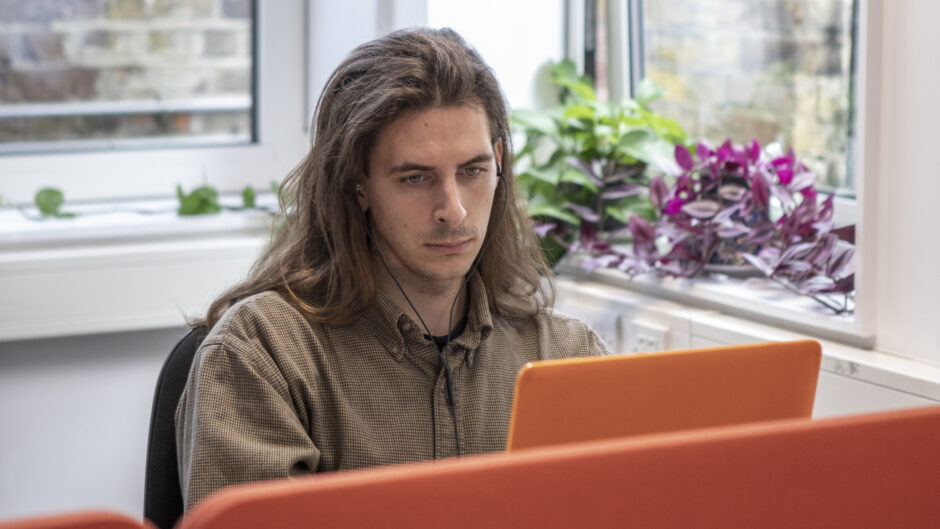 student looking at laptop