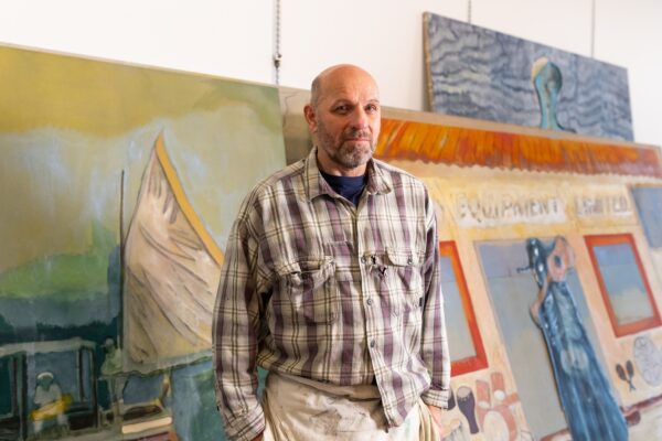 A portrait of the artist Peter Doig in his studio
