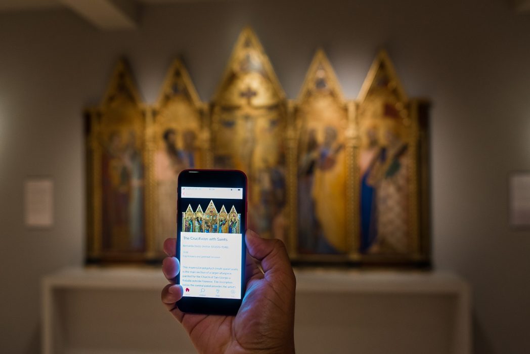 A visitor uses the Bloomberg Connects app in The Courtauld Gallery