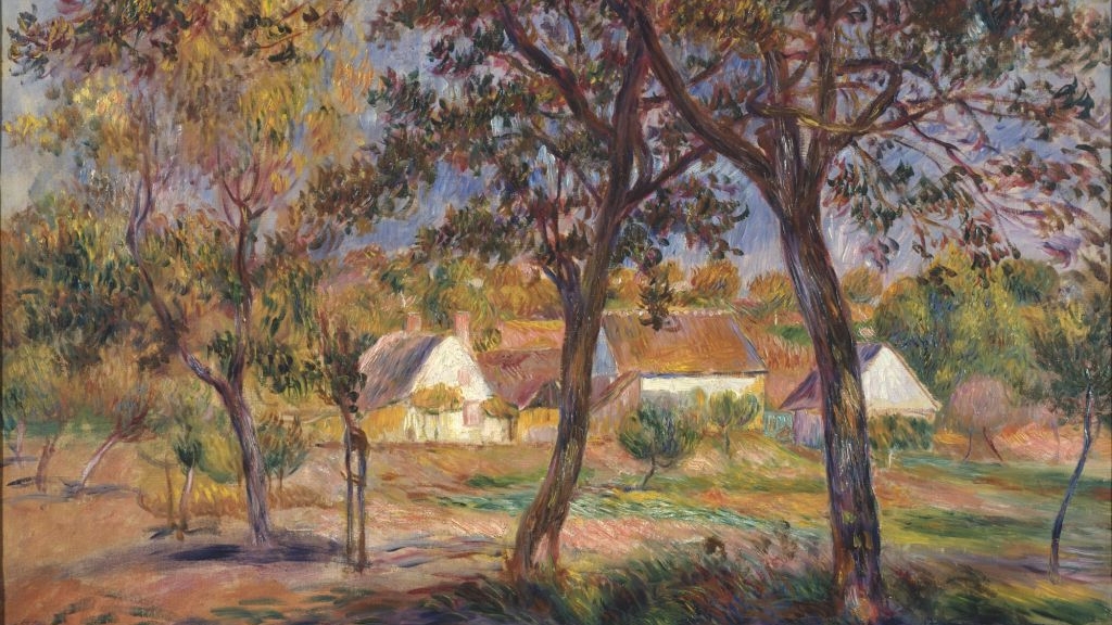 A group of houses can be seen behind the trees in a colourful forest.