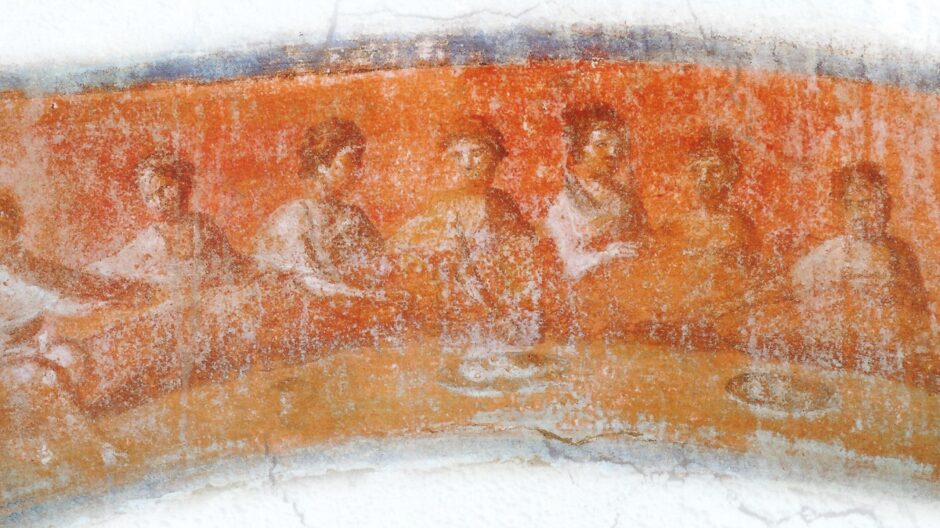 A group of people are seated around a table