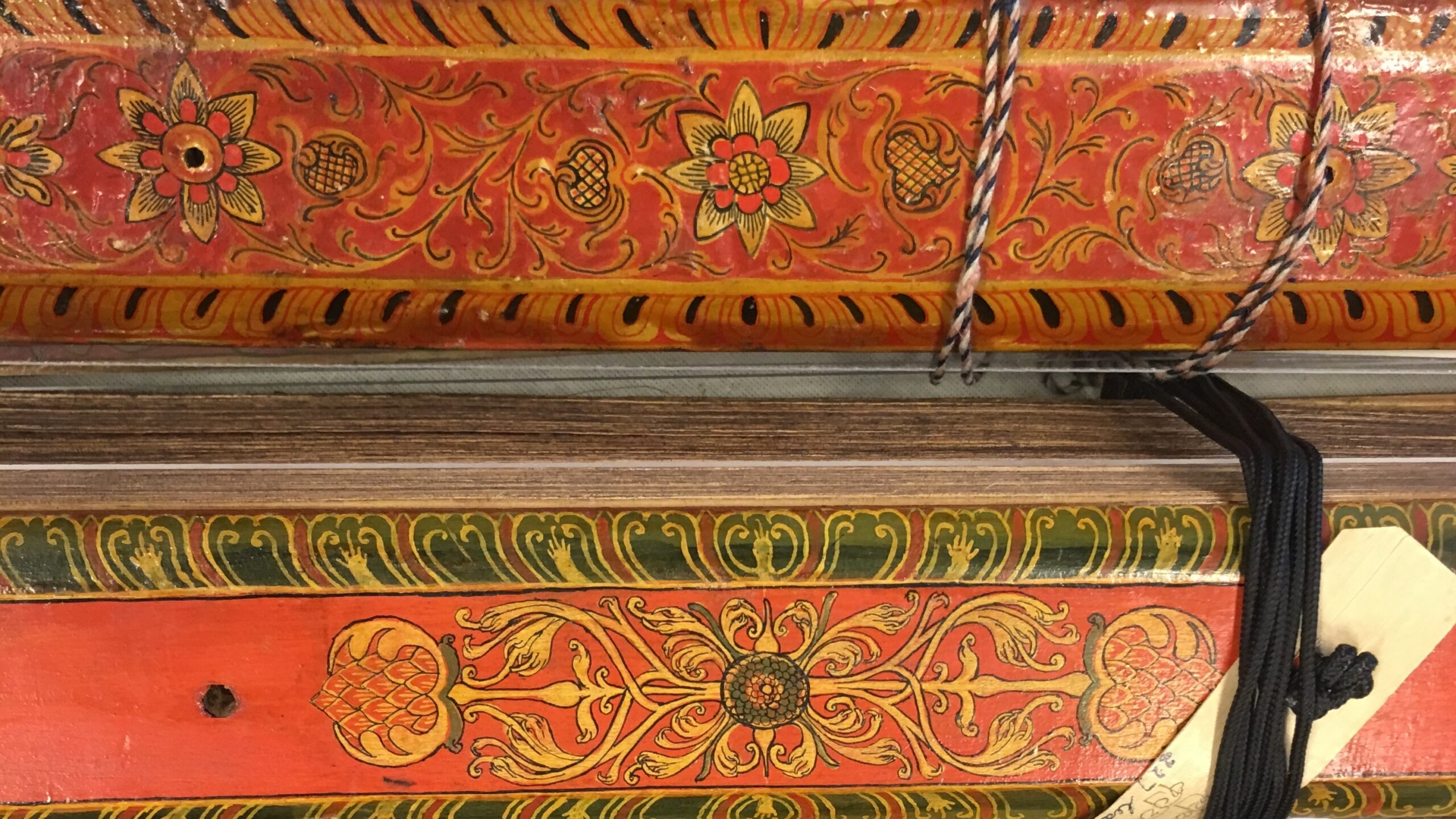 Photograph showing the colourful decorated spines of a series of books