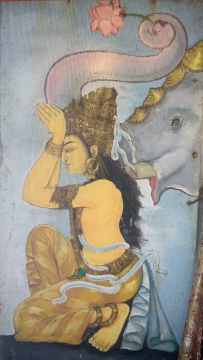 Painting showing a woman kneeling, with her hands in prayer on her forehead, in front of an elephant