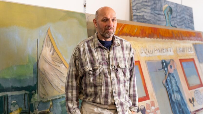 A portrait of the artist Peter Doig in his studio