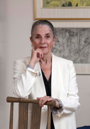 Shulamith Behr in front of artworks