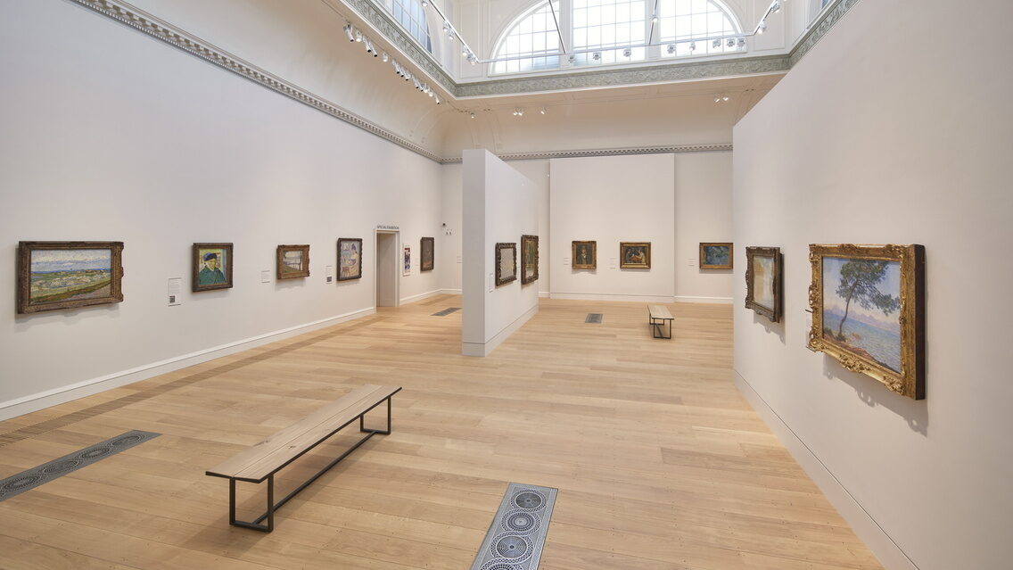 image of the Courtauld's great room showing paintings of Cezanne on the wall