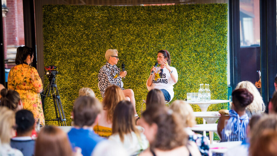 Two people in conversation on stage.
