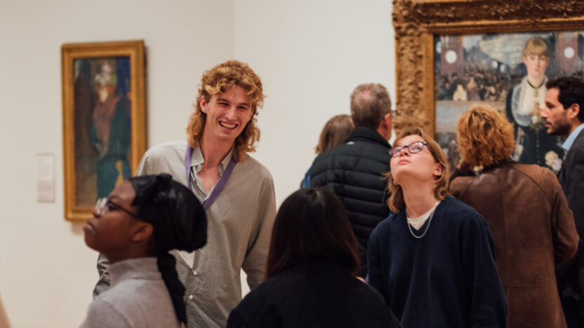 Students being taught infront of a painting in The Courtauld