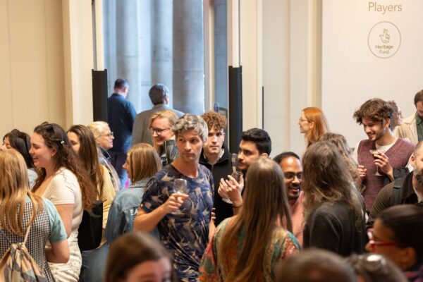 A group of visitors dance in the entrance to The Courtauld Gallery