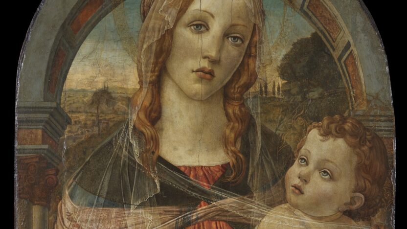 Oil painting of a Virgin and Child, with the Virgin standing in front of an archway wearing an orange-red dress and blue cape holding an infant lightly swaddled. The colours are vibrant but the panel visibly worn.