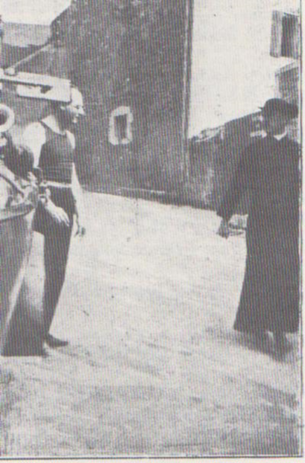 Marcel Duhamel, 'Our Colleague Benjamin Péret Insulting a Priest' (photograph 1926)