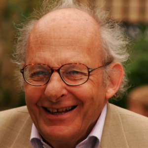 A head and shoulders picture of Michael Kauffmann, wearing glasses and smiling warmly at the camera.