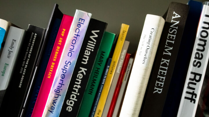 Collection of art books on library shelf