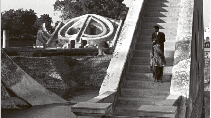 Cover of the book 'International Departures: Art in India After Independence' by Devika Singh. The photograph on the cover shows a large, freestanding staircase up and down which people are climbing.