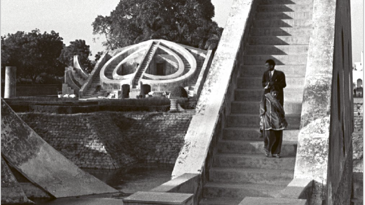 Cover of the book 'International Departures: Art in India After Independence' by Devika Singh. The photograph on the cover shows a large, freestanding staircase up and down which people are climbing.