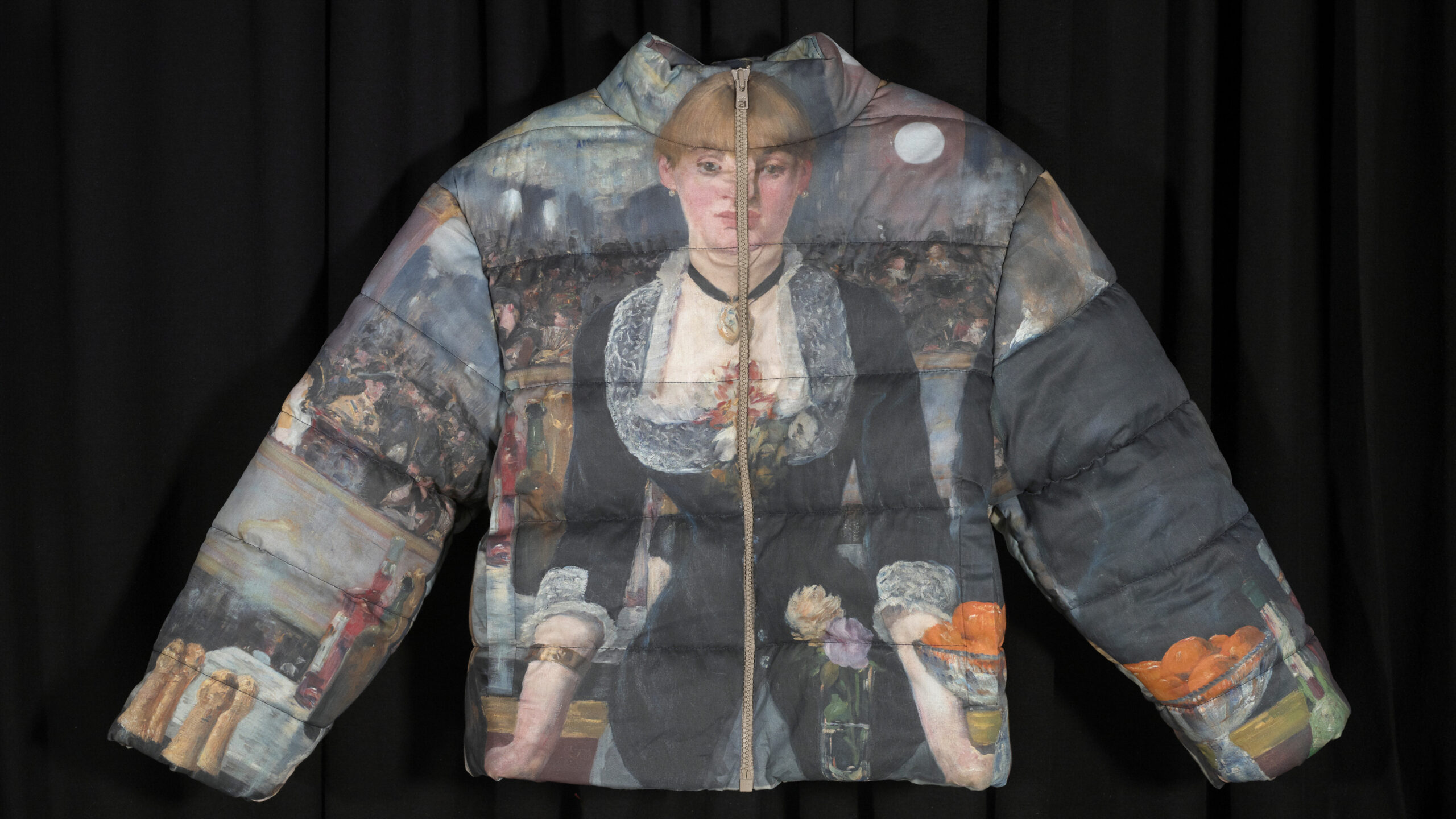 A photograph of the front of a coat, with Manet's bar painting as the material.
