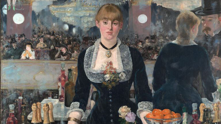 A woman standing behind a bar facing straight ahead.