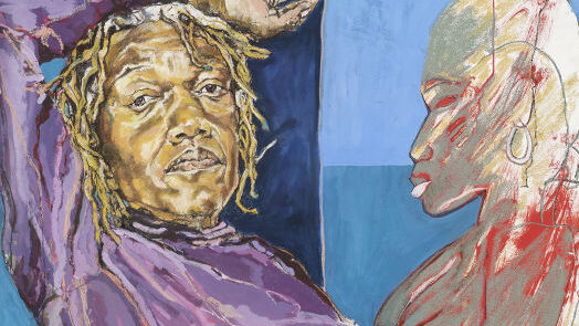 A woman standing next to a sculpture