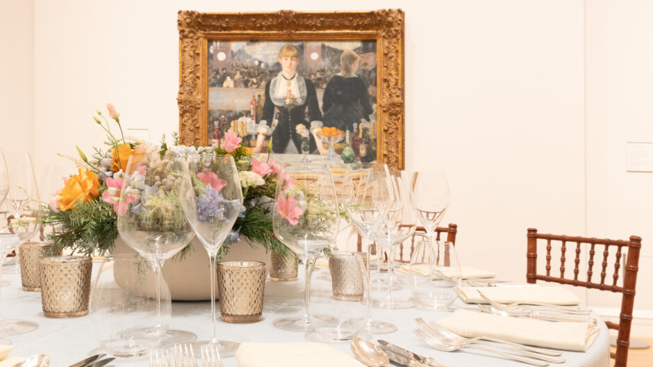 A private dining table presentation in front of Manet's A Bar at the Folies-Bergère, in the LVMH Great Room