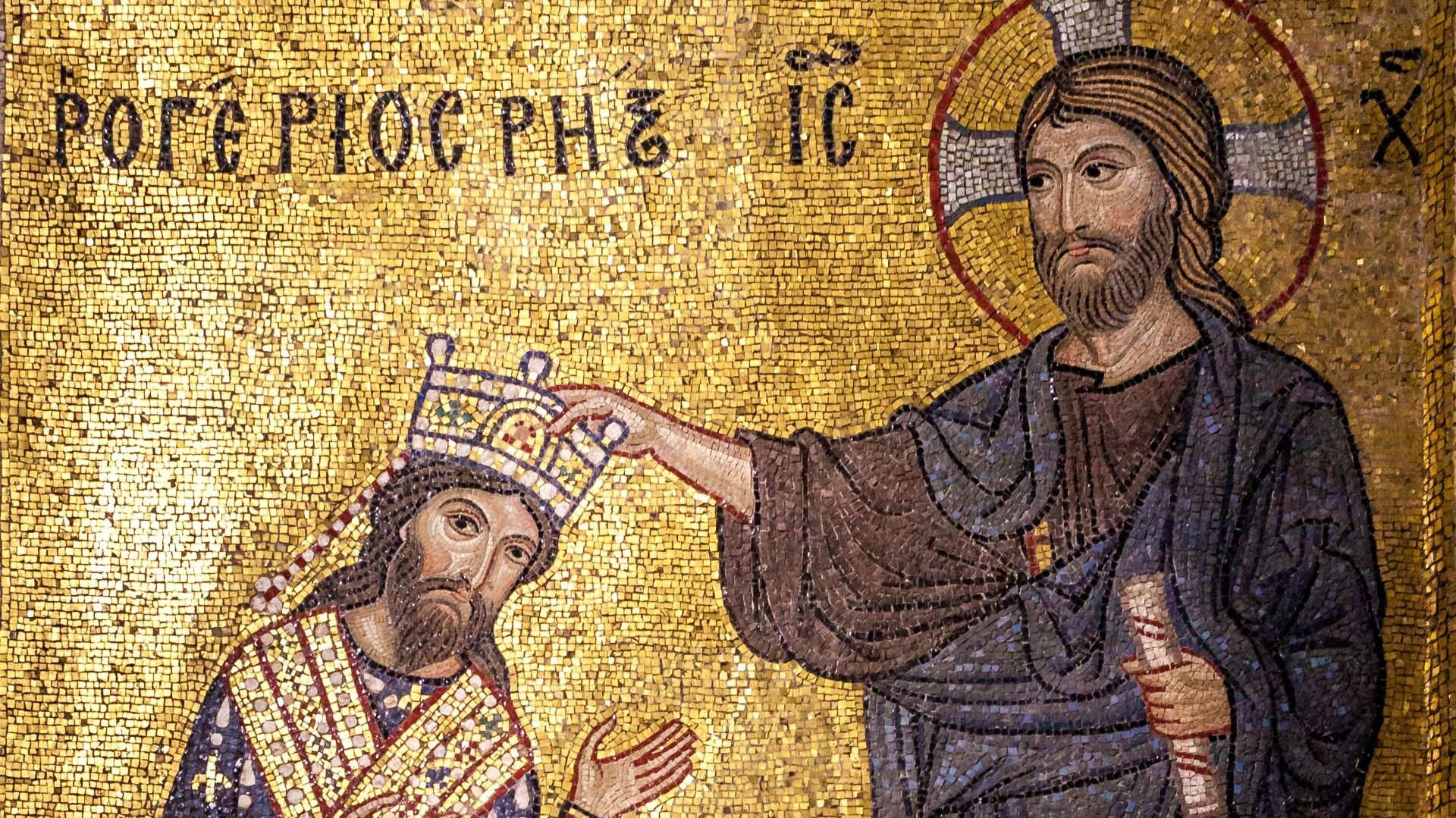 A Mosaic detail of Roger II wearing a blue robe and a gilded sash, receiving the crown from Christ. Christ appears taller than him and as if hovering, wearing a brown and dar blue robe, he also holds a parchment on his left hand.