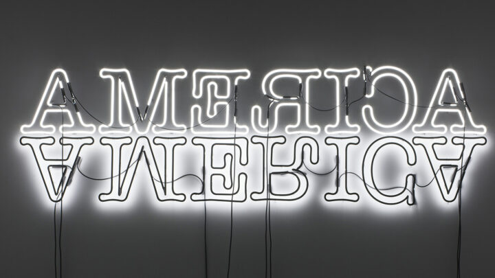 Double American mirrored neon sign in a gallery black and white