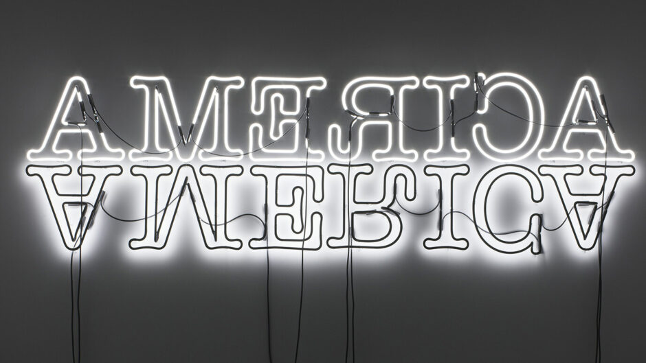 Double American mirrored neon sign in a gallery black and white