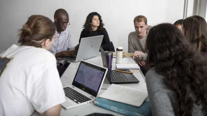 Young people sitting at a desk