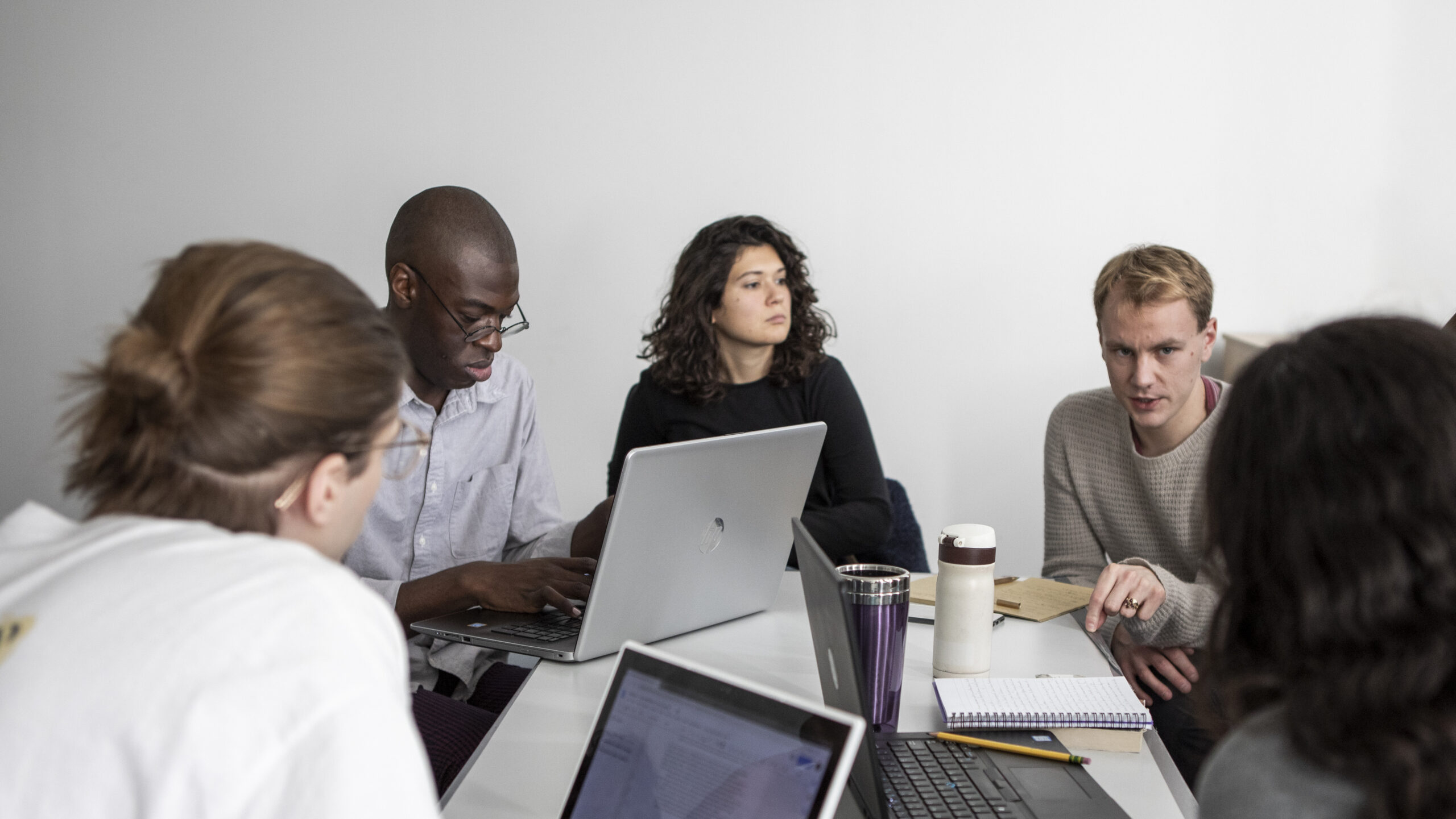 Young people sitting at a desk