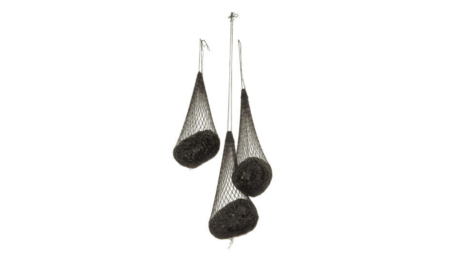 Sculpture with three dark nets hanging
