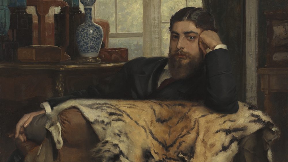 A 19th-century painting of a bearded man in a dark suit, reclining thoughtfully on a chair draped with a tiger skin, with books and a vase in the background.