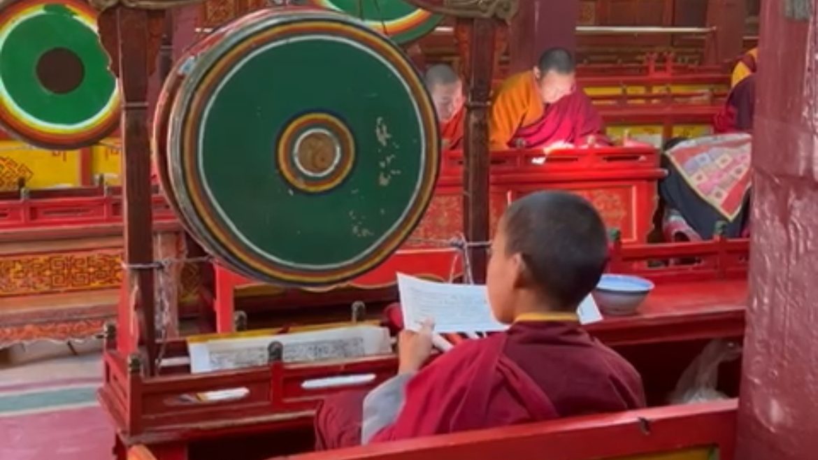 colorful interior with large painted gongs.