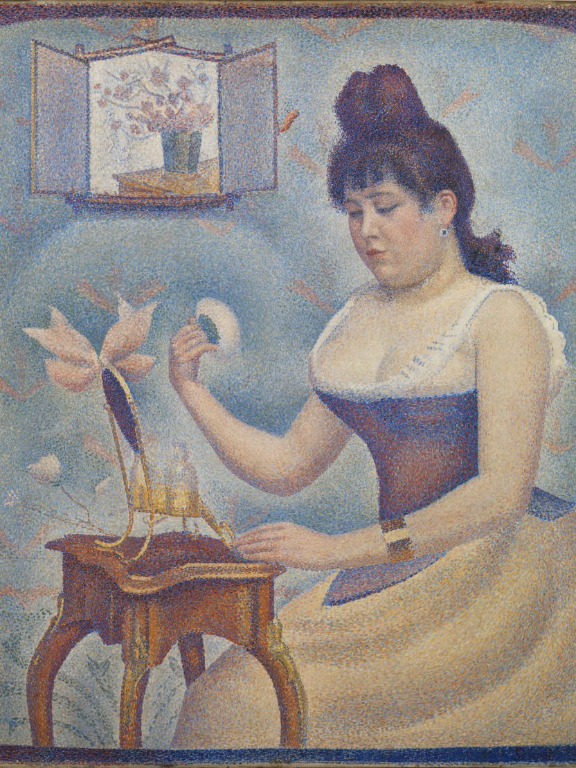 A painting, using the classic pointillist technique of lots of tiny dots of colour made up to reveal a bigger picture, of a woman, wearing a corset and skirt, powdering her face while seated in front of a small table and mirror. In the top corner there is a frame, with a vase of flowers painted in.