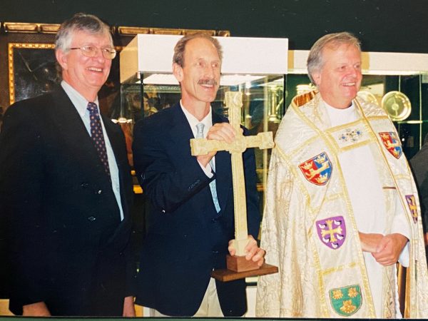 Very Reverend James Atwell (right), Ronald Street (centre), and Charles Little (left), with a replica of the Cloisters Cross, September 2004, at St Edmundsbury Cathedral.