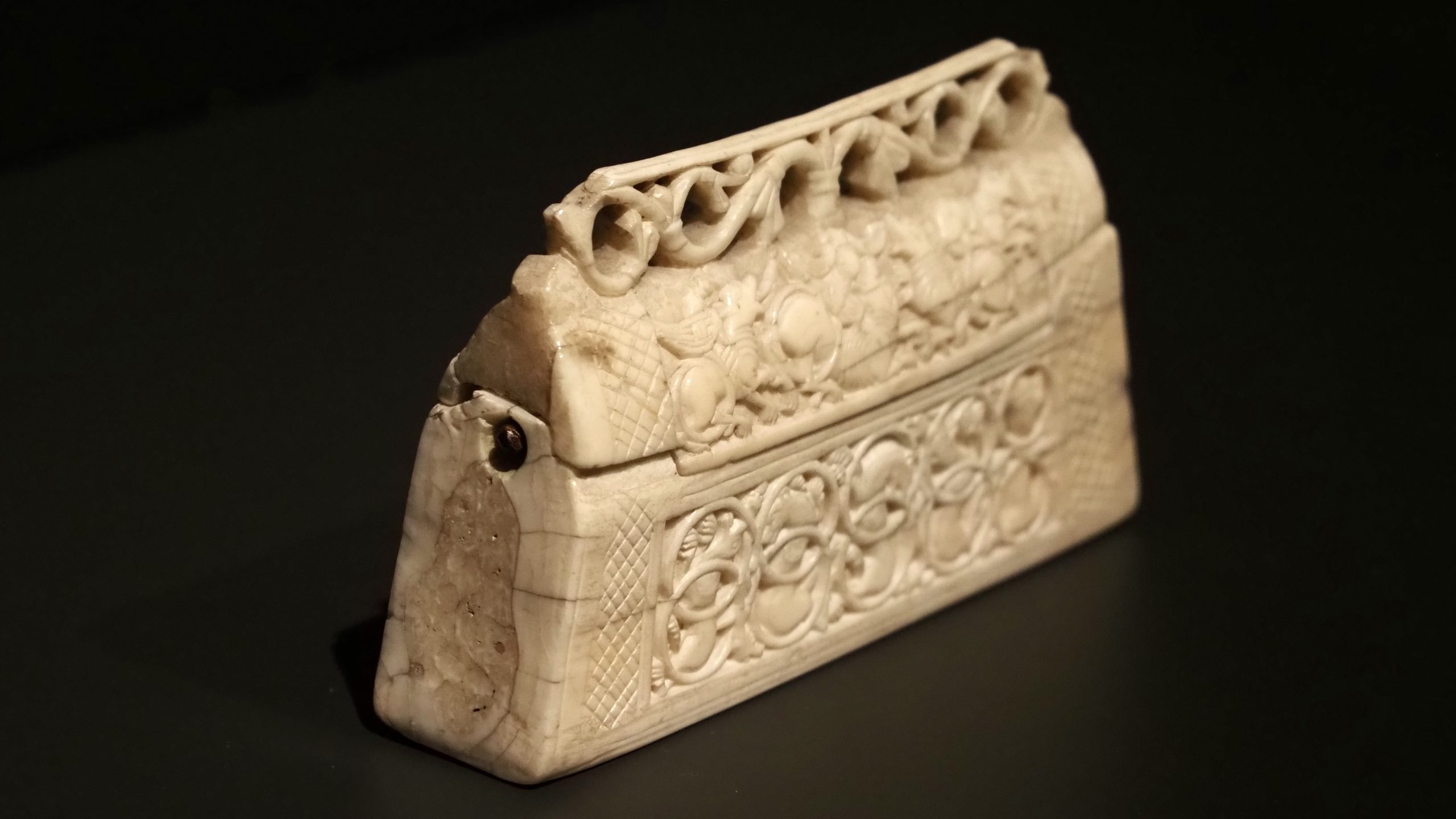Purse reliquary, ca. 1125, walrus ivory, 7.7 x 13.4 x 2.8 cm.