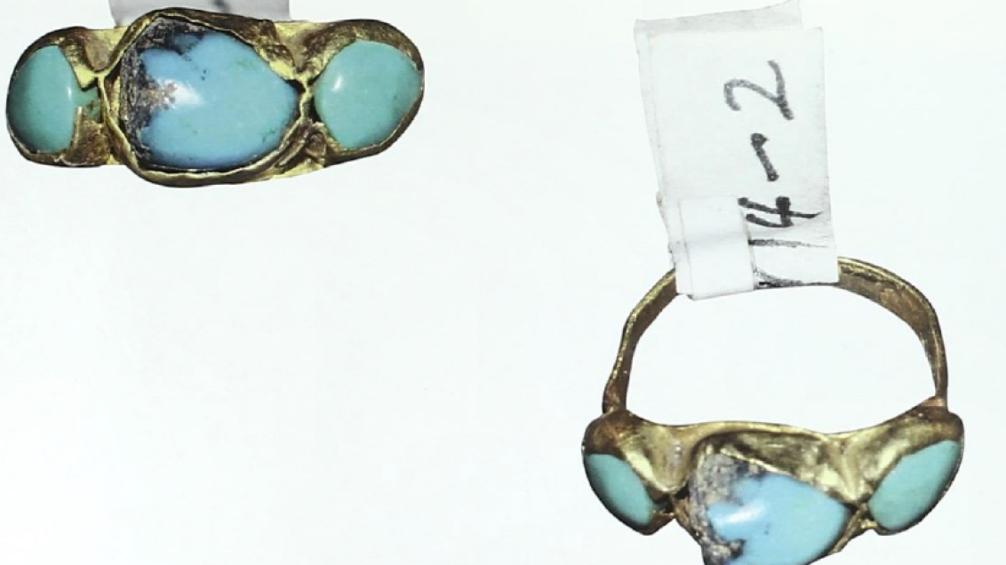 Early Modern gold ring set with three turquoise stones, shown from multiple angles on a white background, with small paper catalogue labels attached.