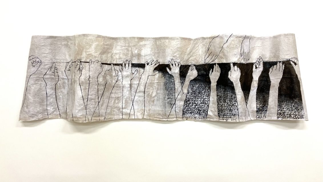 Multiple illustrations of hands pointing, resting, grabbing, touching woven onto a single crinkled piece of monochrome fabric.