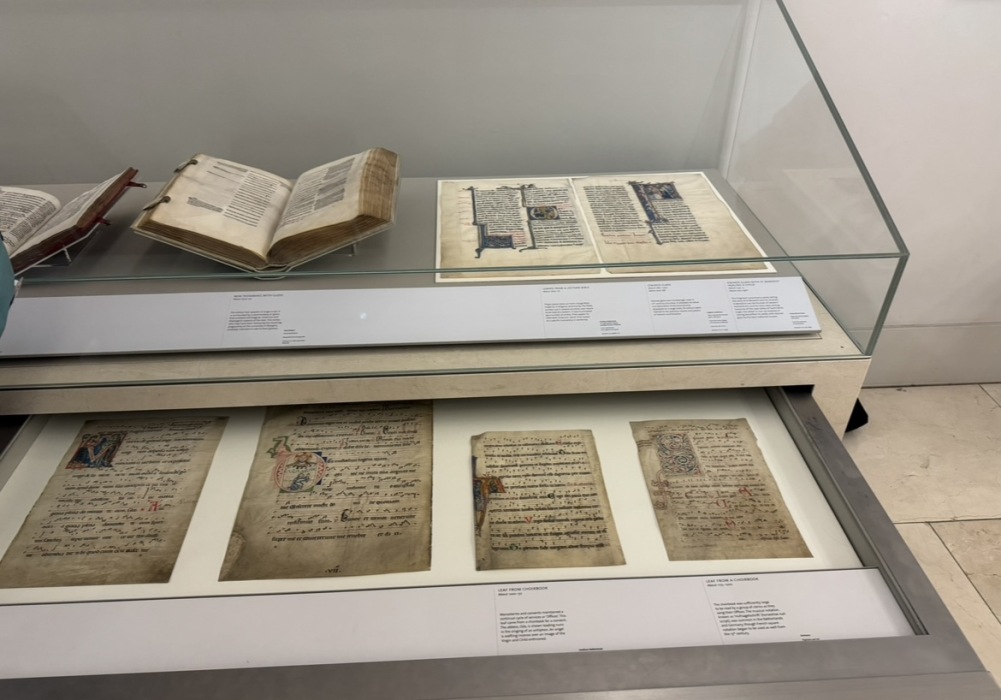 Manuscripts in a glass display case in the V&A museum.