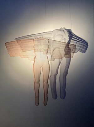 An image of an artwork featuring two figures surrounded by a shadow