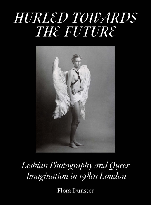 Front cover of book, featuring a black and white photograph of a woman with short hair dressed in a pair of large wings and a white wrap around her waist